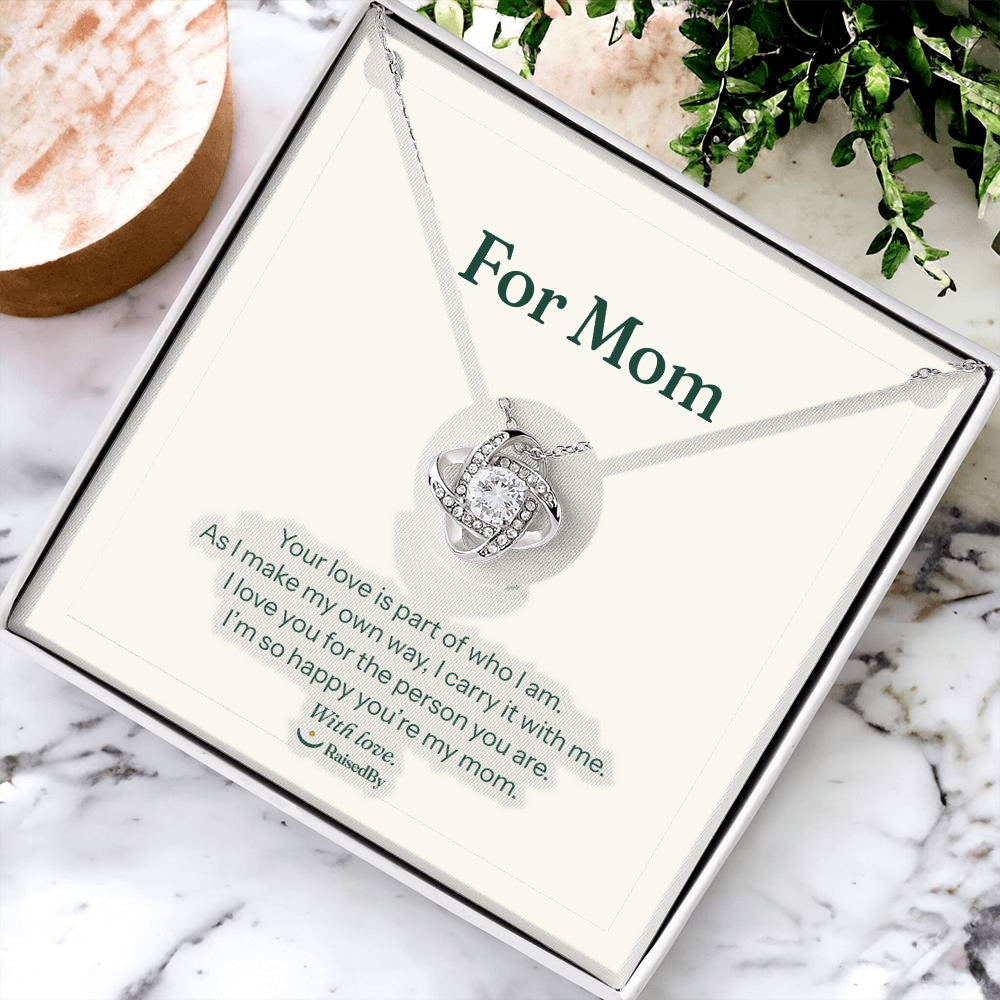 For Mom message card necklace in gift box on marble. Your love is part of who I am.